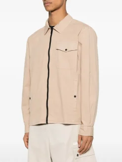 Giacca beige con tasche e chiusura a zip