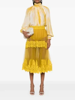 Gonna midi giallo ocra con pannelli in pizzo