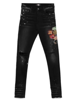 Jeans magri con patch
