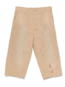 Pantaloni beige con un effetto di vernice