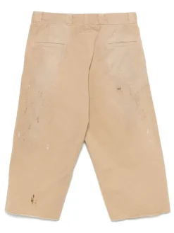 Pantaloni beige con un effetto di vernice